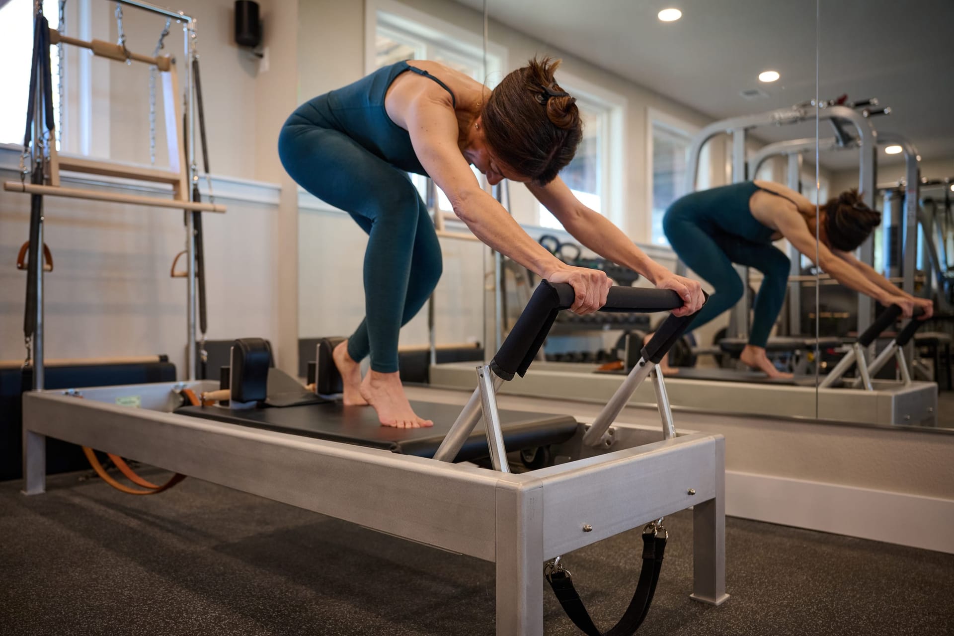 Dynamic Reformer exercise demonstrating full-body control and strength